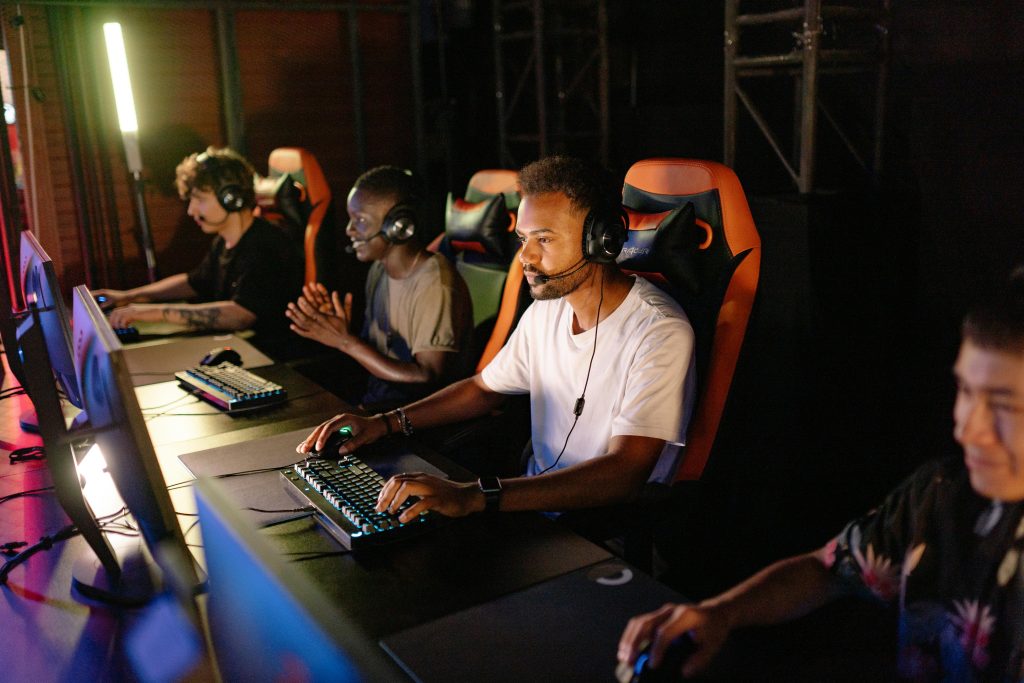 pexels photo 9072268 9072268 A group of young adults intensely focused on a competitive esports tournament indoors.